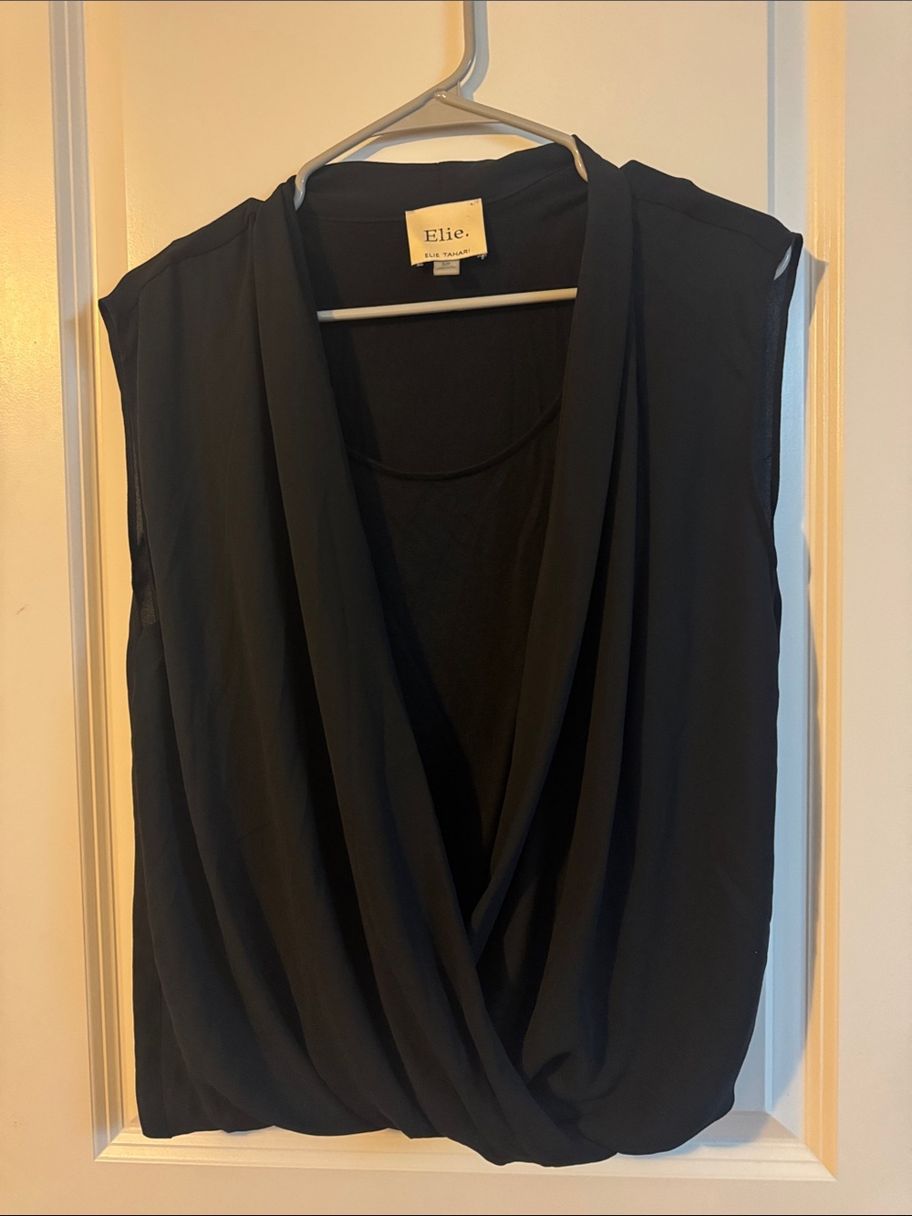 Ellie women’s
Black small crossed drape blouse sleeveless